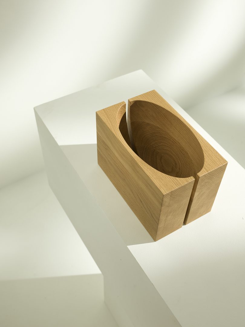 abstract set of medium wood objects that form a bowl when brought together