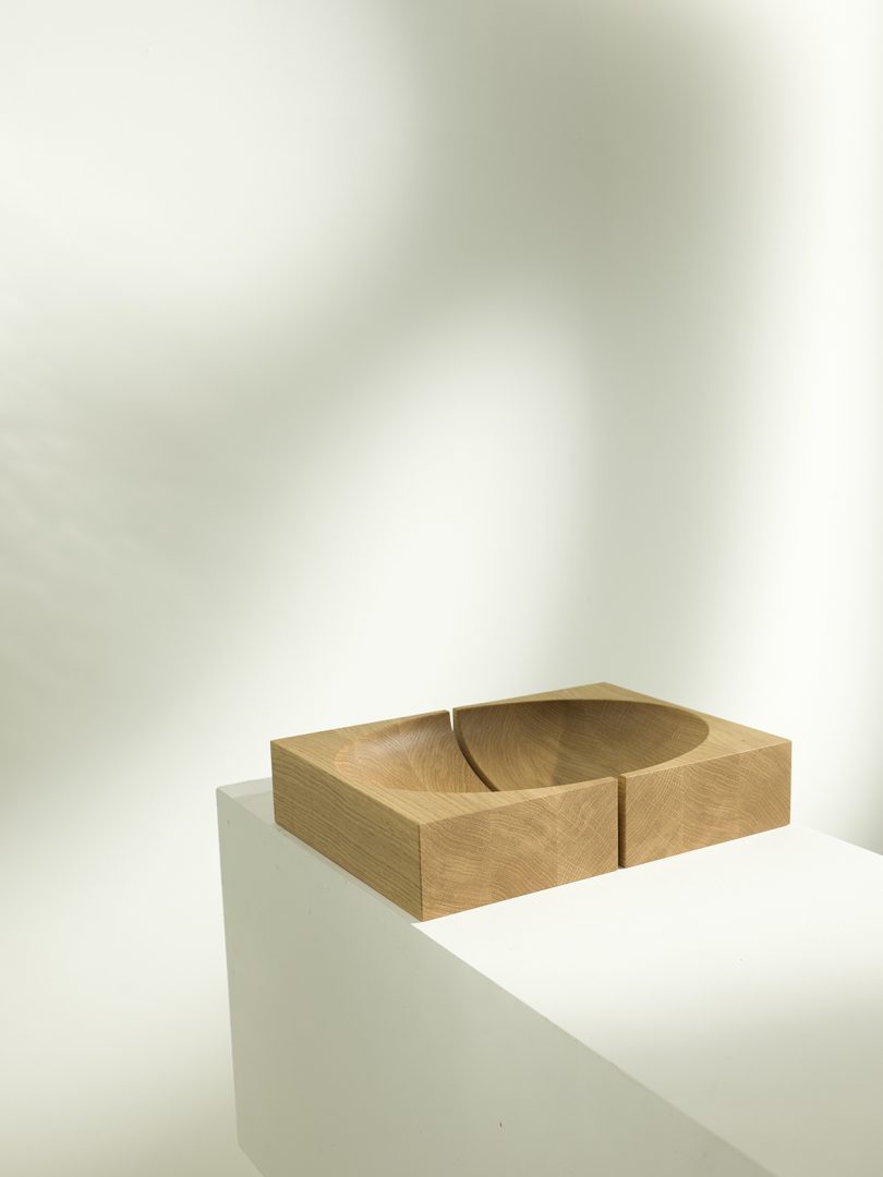 abstract set of medium wood objects that form a bowl when brought together