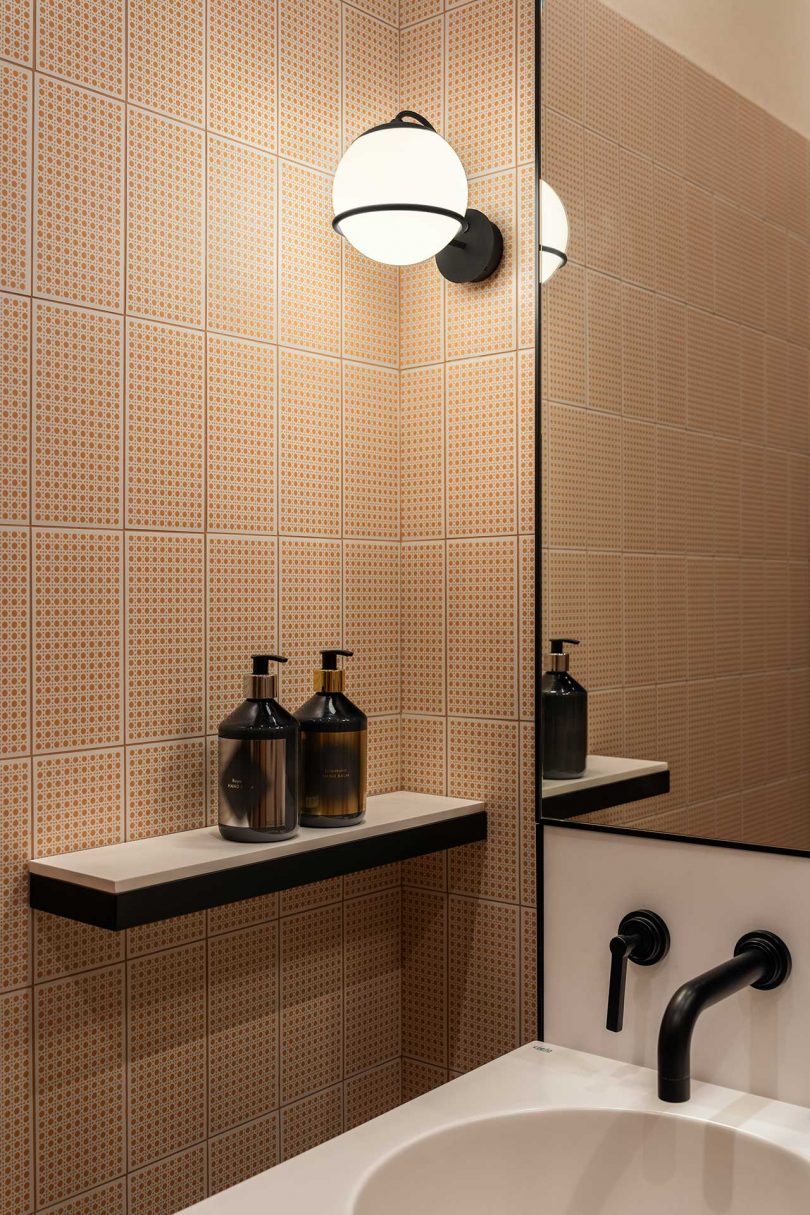 modern bathroom with peach colored tile walls