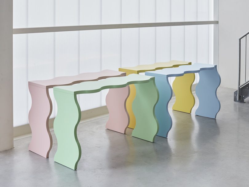 wavy light pink, yellow light green, and light blue library tables