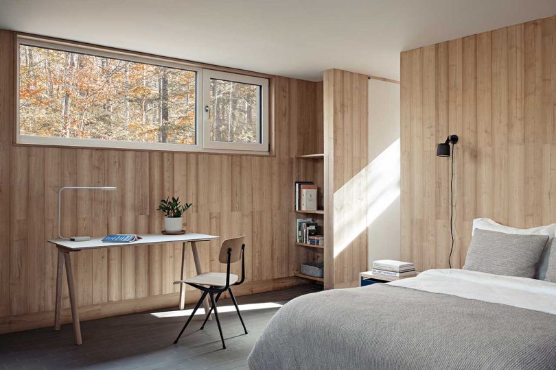 interior view of modern minimalist bedroom in modern rustic cabin