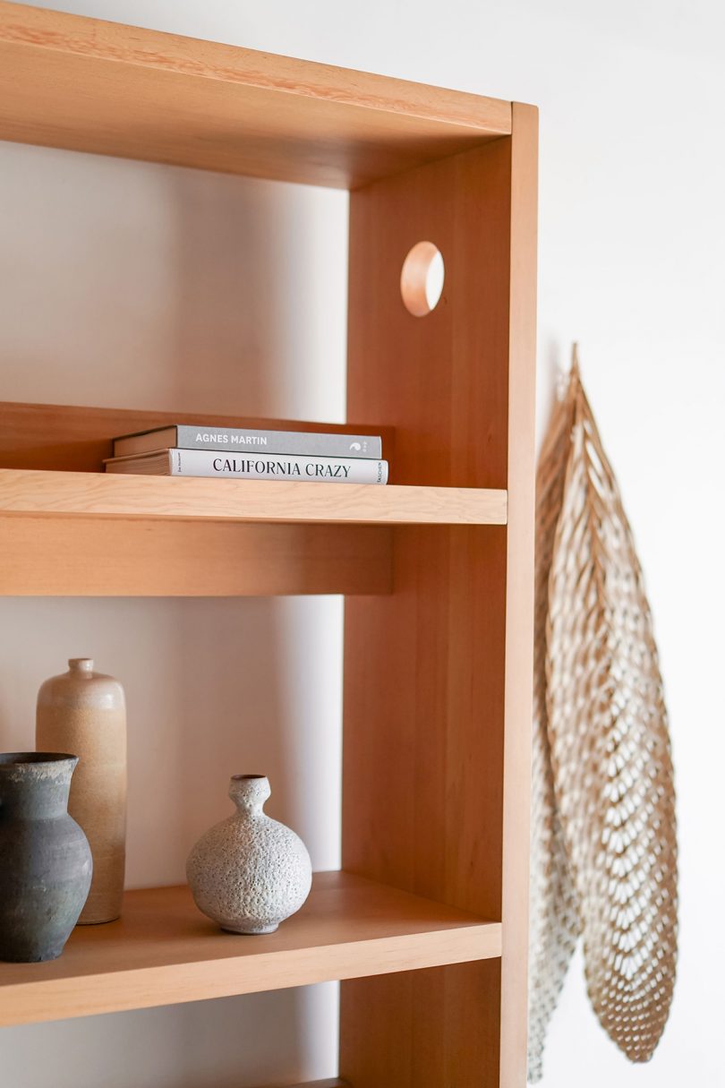 styled light wood tall bookcase