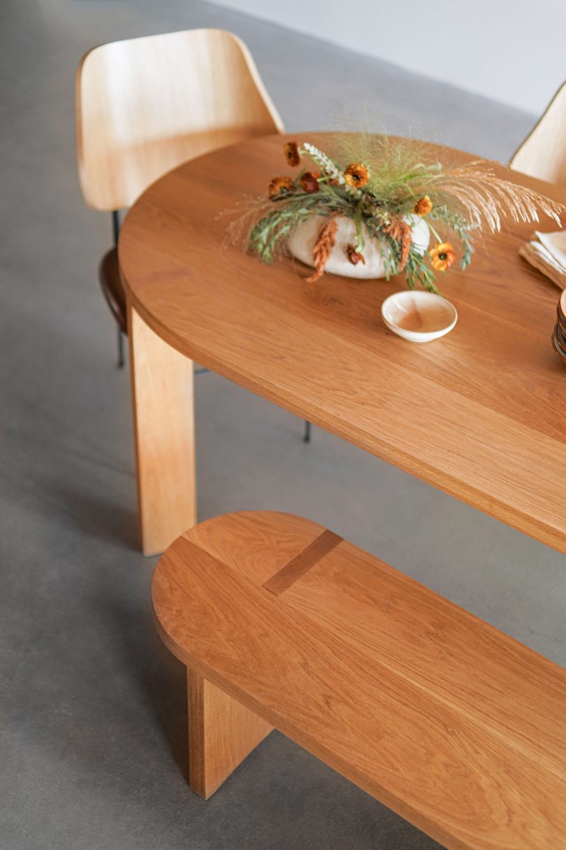 styled medium wood dining table and bench