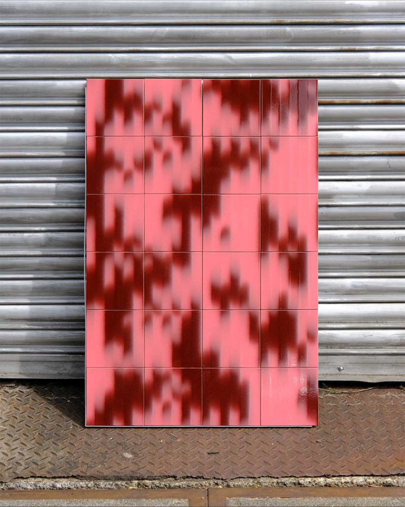 panel of graphic patterned tile in pink and burgundy