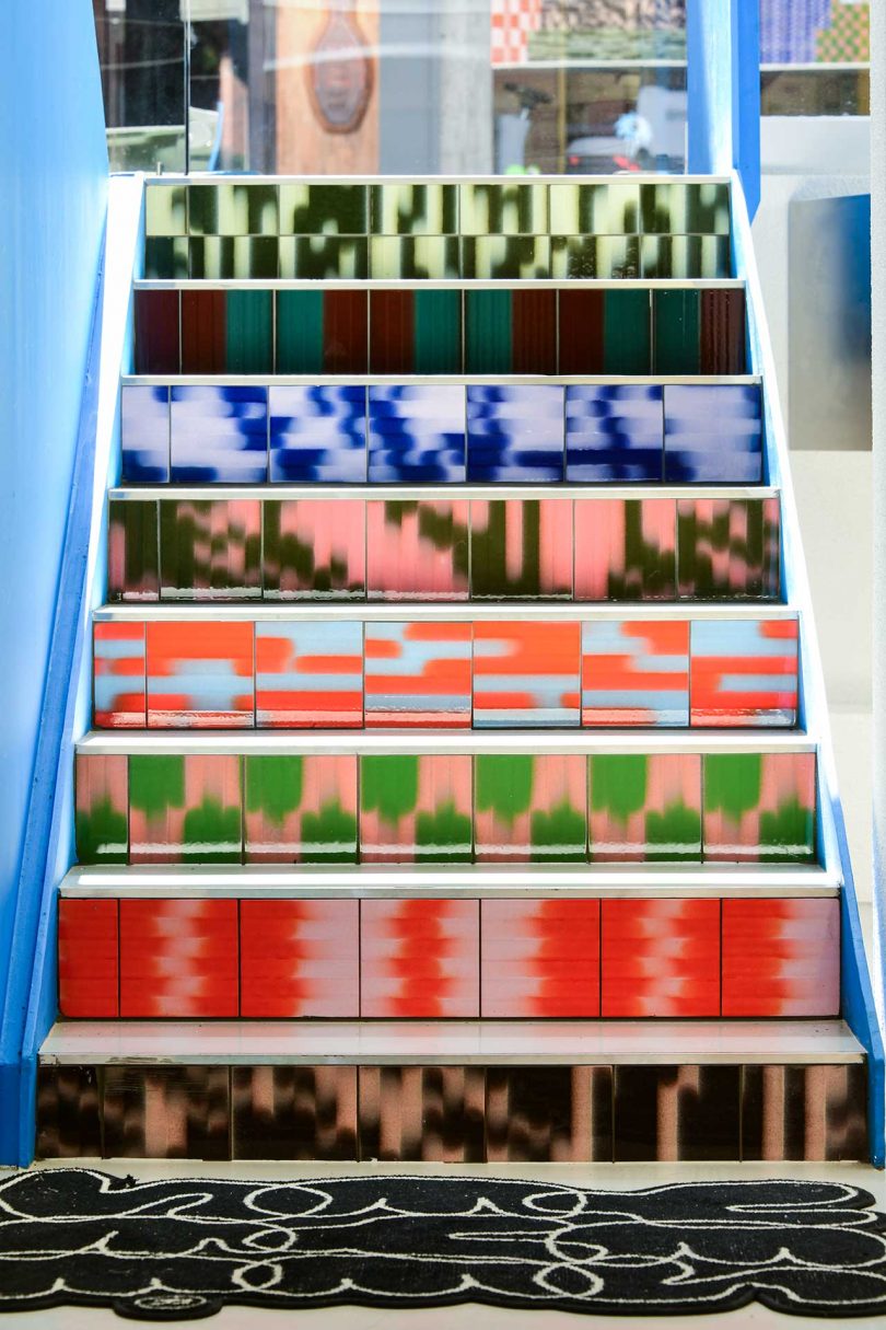 staircase with risers covered in colorful, patterned tile