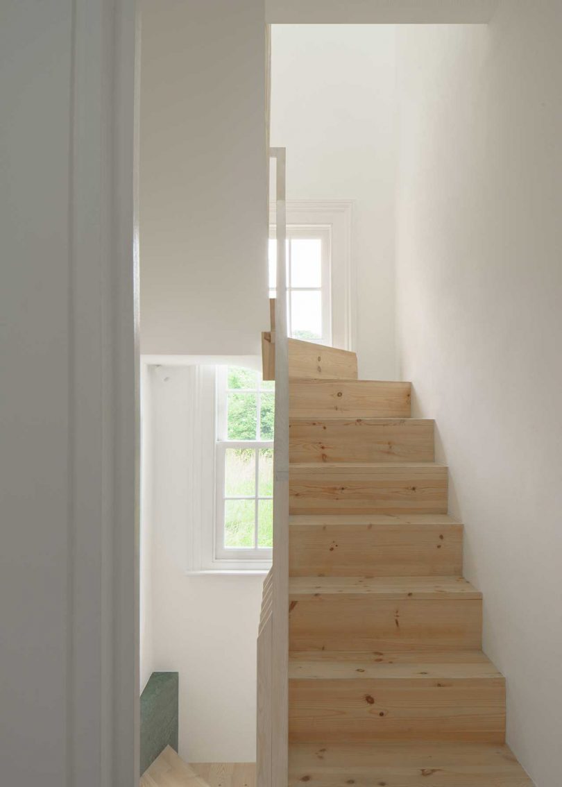narrow wooden staircase view