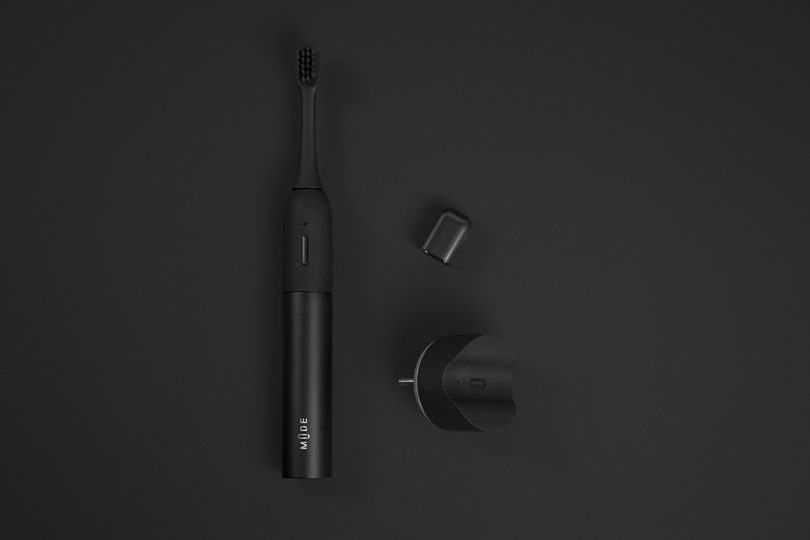 minimalist black electric toothbrush in parts