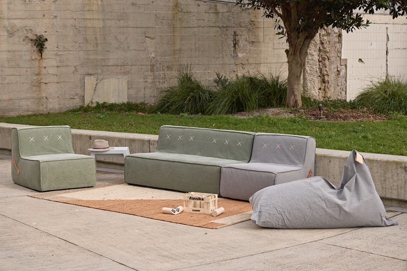 grey and green canvas covered outdoor sofa, chair, and beanbag chair