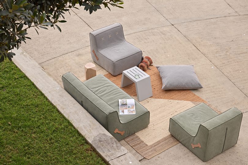 grey and green canvas covered outdoor sofa, chair, and beanbag chair