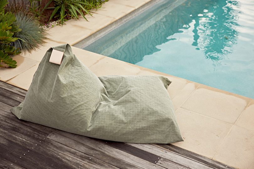 green canvas covered outdoor beanbag chair