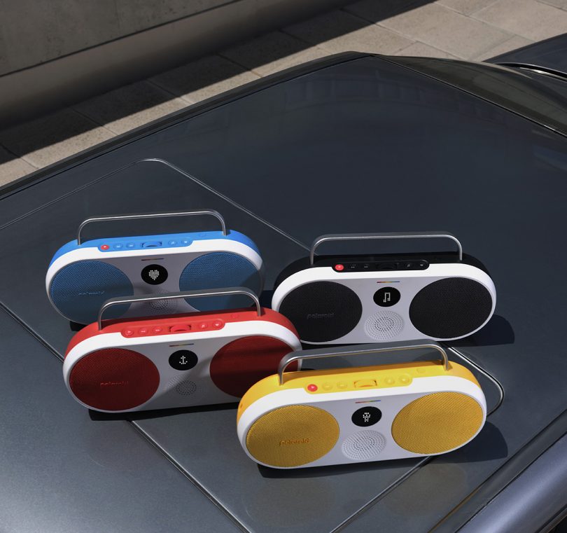 Found Polaroid P3 in blue, red, black and yellow colors set on top of a car roof.
