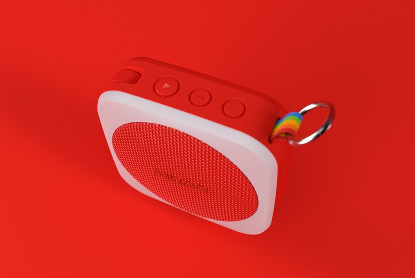 red backdrop with red and white Polaroid P1 speaker in front