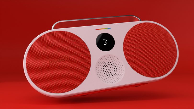 Red boom-box-like Polaroid P3 set against red background.