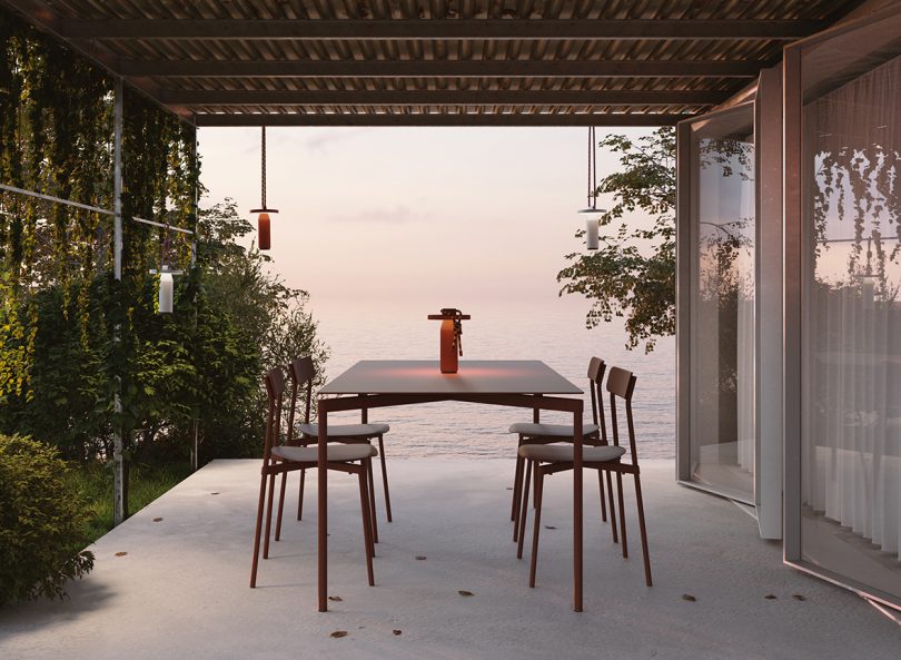 outdoor terrace with dining table and four chairs