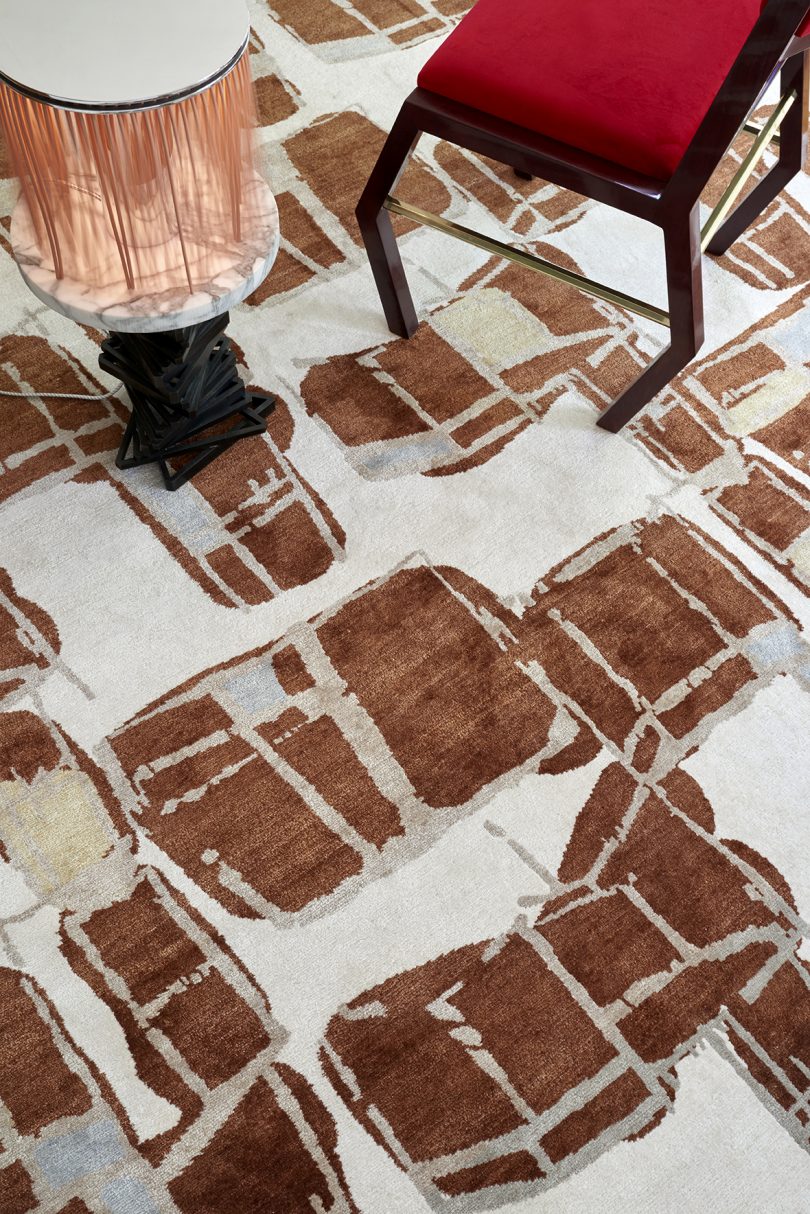 styled floor carpet with an abstract pattern in burnt sienna
