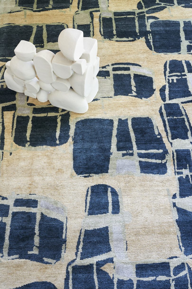 styled floor carpet with an abstract pattern in dark blue