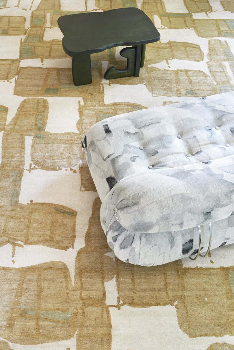 styled floor carpet with an abstract pattern in beige