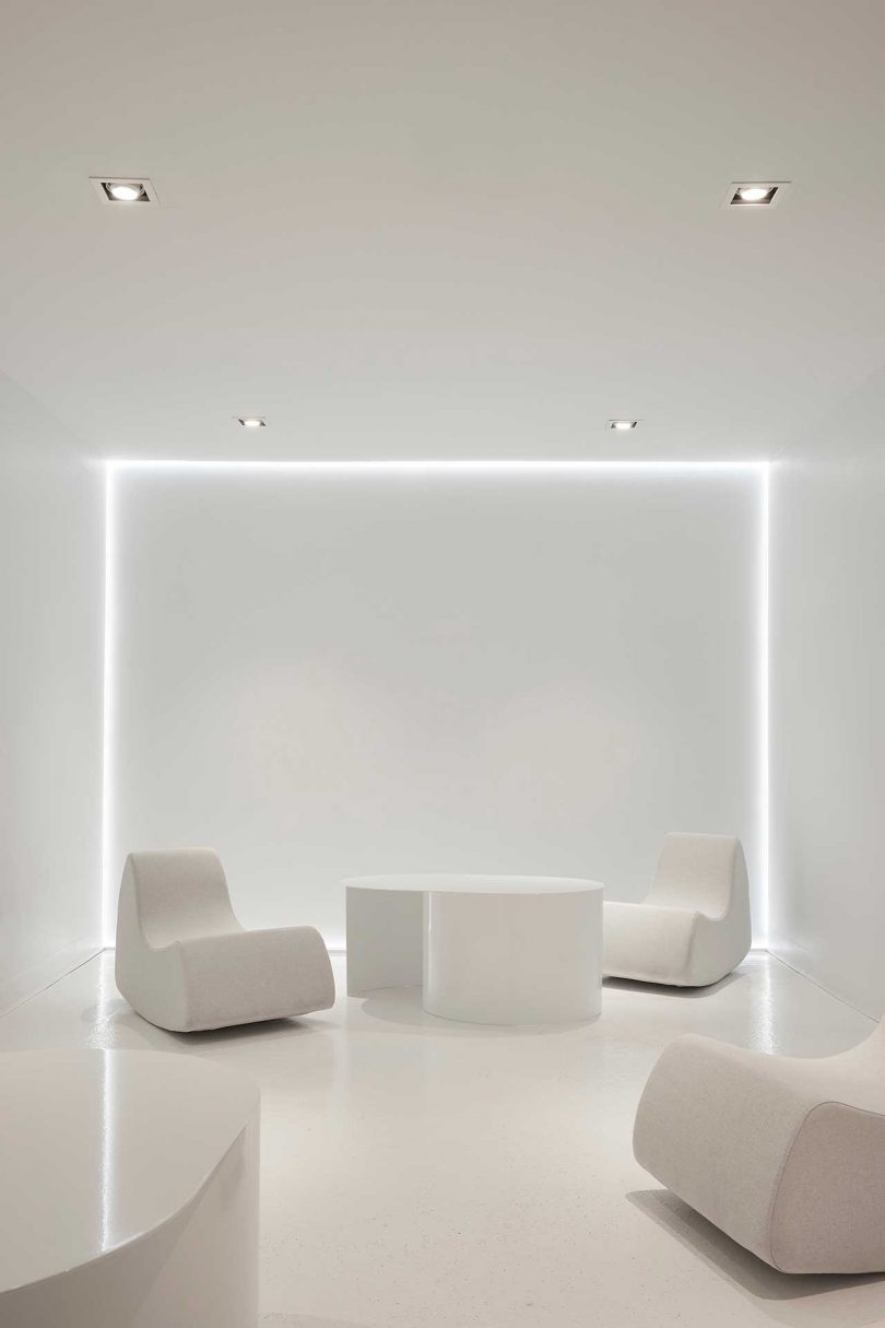 all white office interior seating area with white furnishings