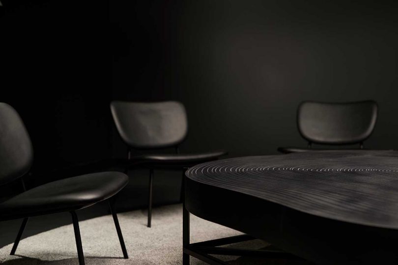 office interior conference room in all black with round table and chairs
