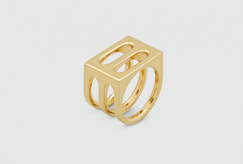 gold ring on light gray background