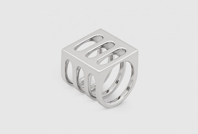silver ring on light grey background