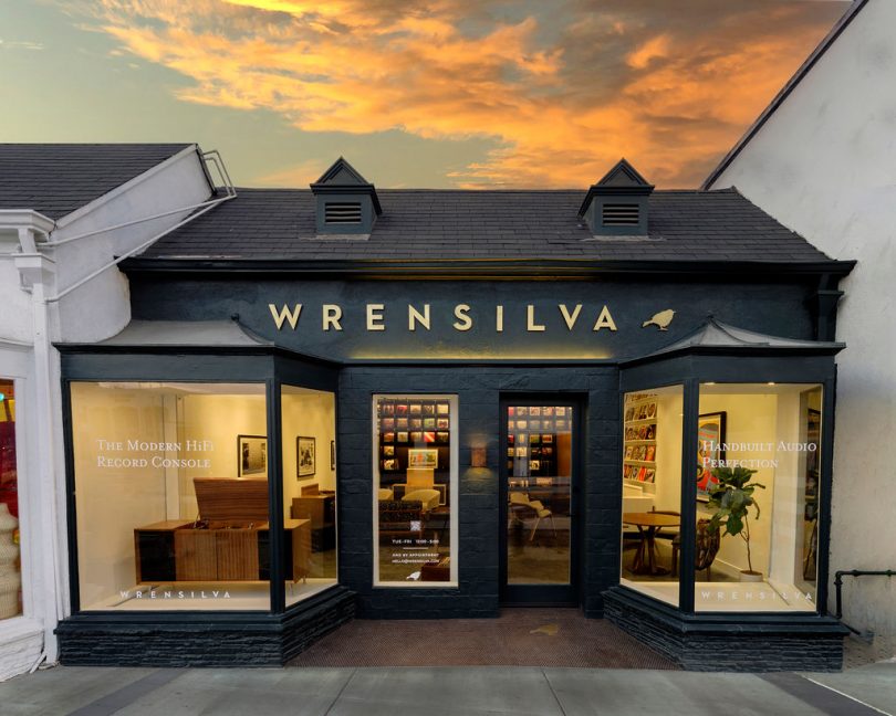 Storefront of Wrensilva West Hollywood shop with orange and yellow sunset clouds in the background.
