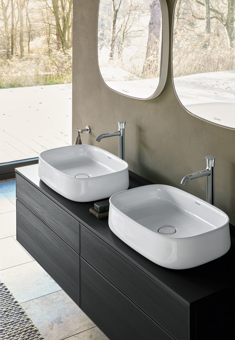 rounded square white sinks in a minimally styled space