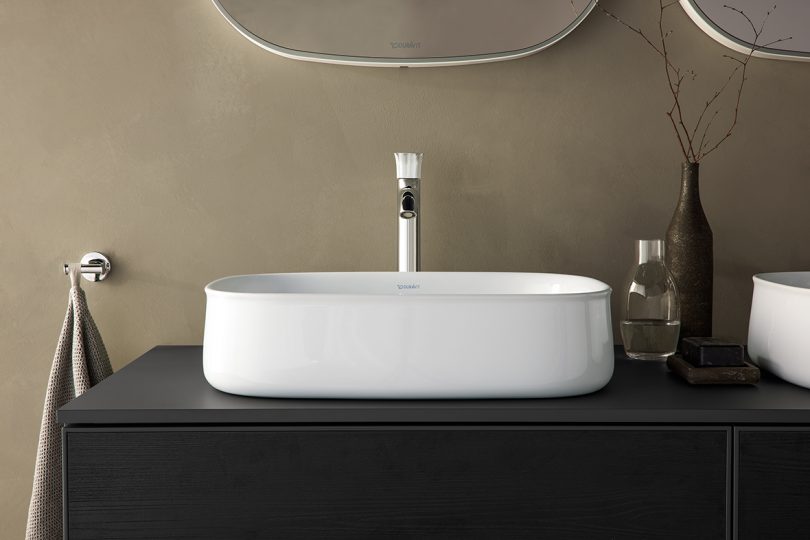 rounded square white sink in a minimally styled space