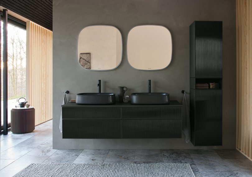 modern minimal bathroom with black fixtures and grey walls