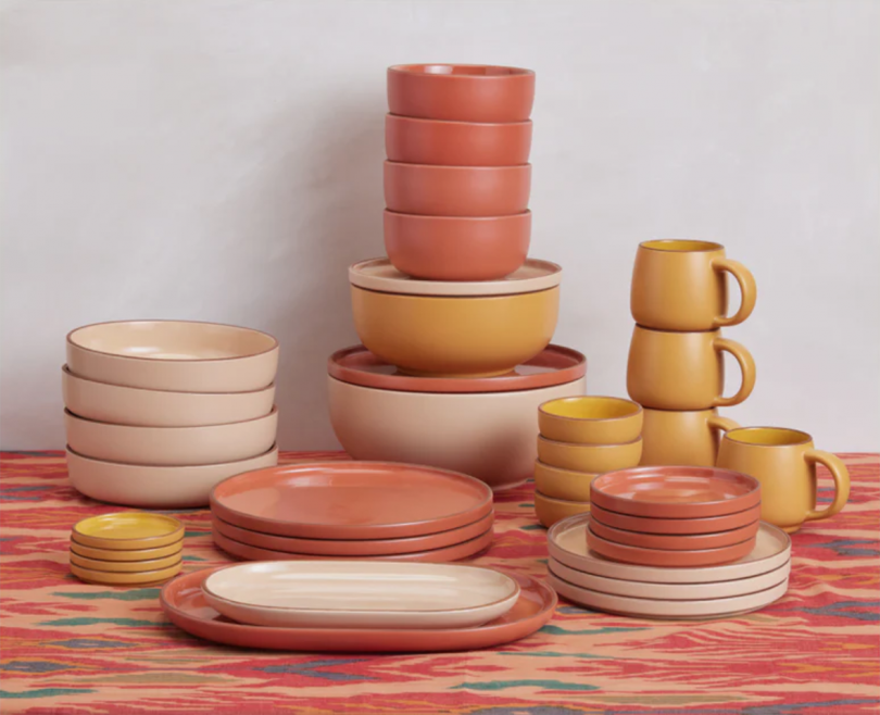 dinnerware for four in subdued, warm colors