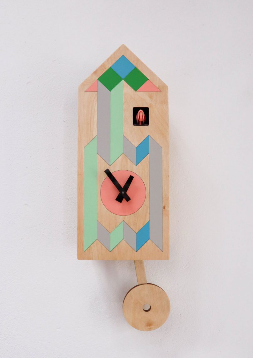 tall and narrow cuckoo clock with pastel geometric design