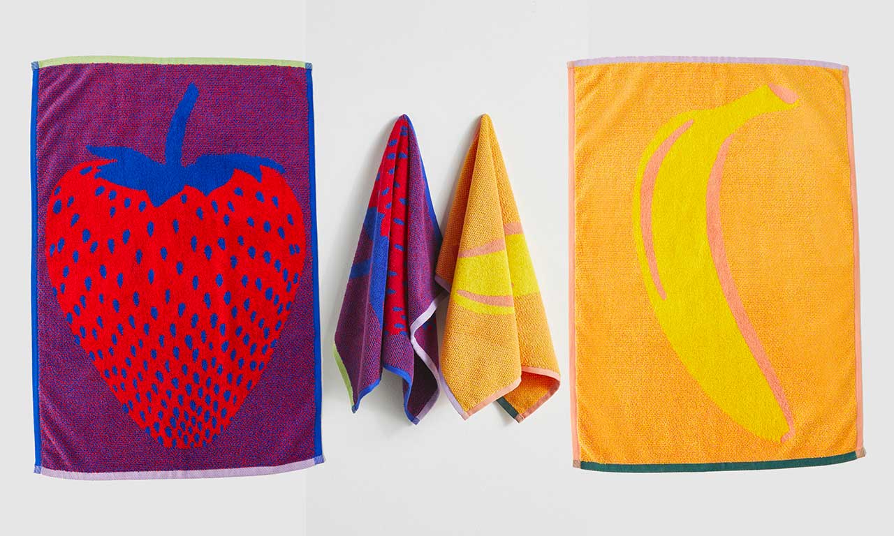 baggu hand towels one strawberry and one banana hanging