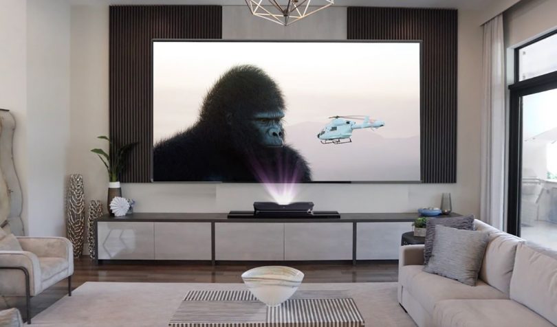 AWOL short throw projector simulating a 120" screen display with King Kong and a helicopter on the screen.