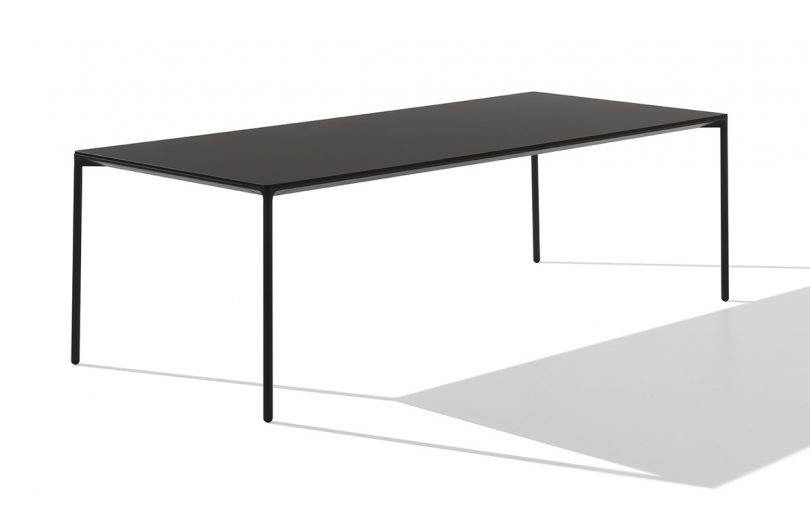 long minimal dining table on white background
