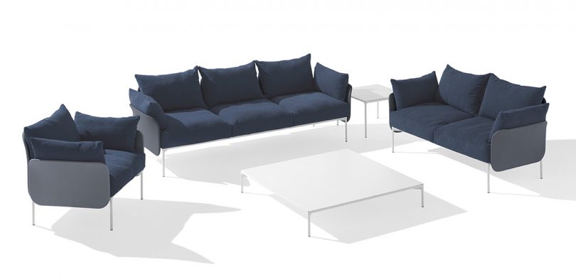 3-seat and 2-seat sofas and armchair in dark blue with white side table and coffee table on white background
