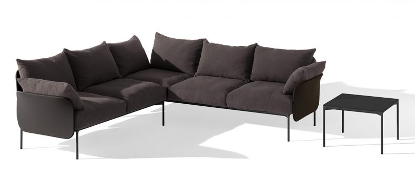 dark brown L-shaped sofa on white background