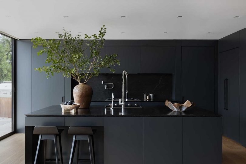interior photo of modern home's all-black kitchen