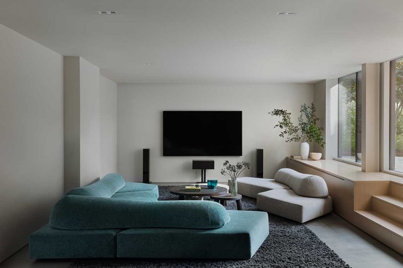 interior view of lower level modern tv watching and sitting room