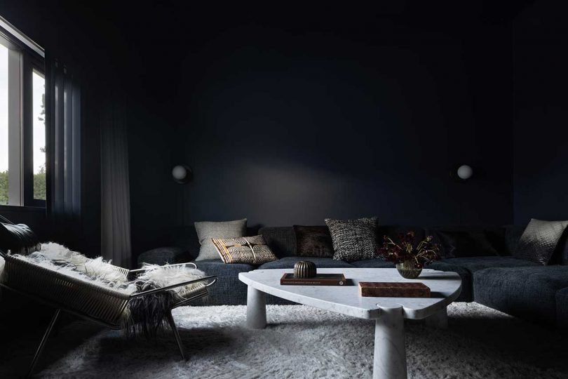 all black living room in modern house