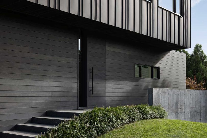 closeup exterior shot of modern two-story black house