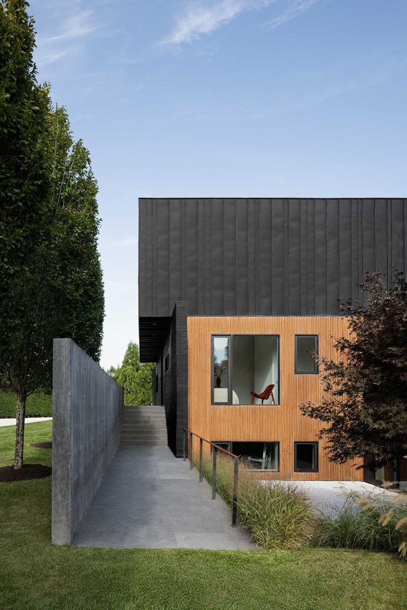 daytime exterior shot of modern two-story black house