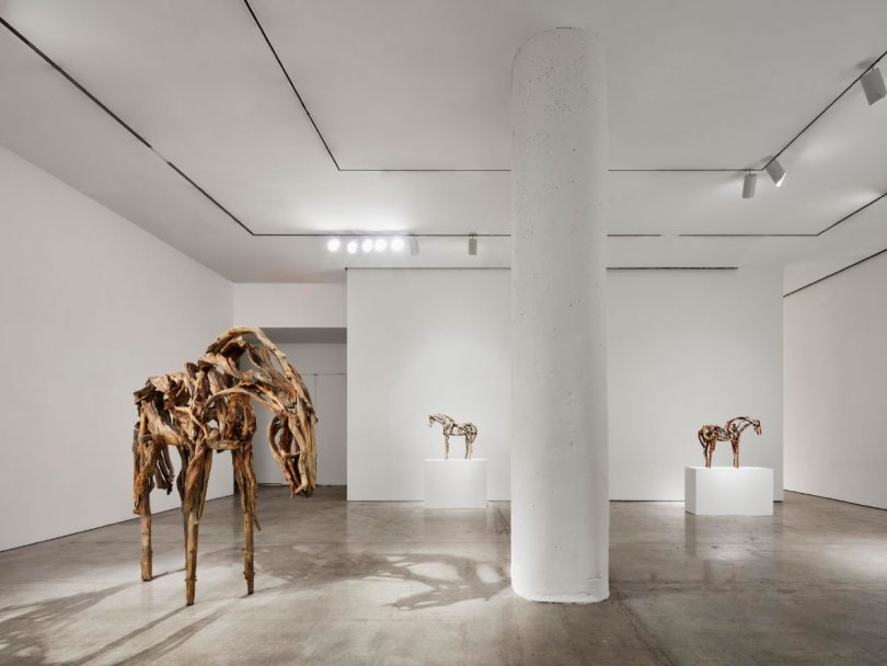 Main room of gallery exhibition with large "Sweetgrass" and smaller sculptures