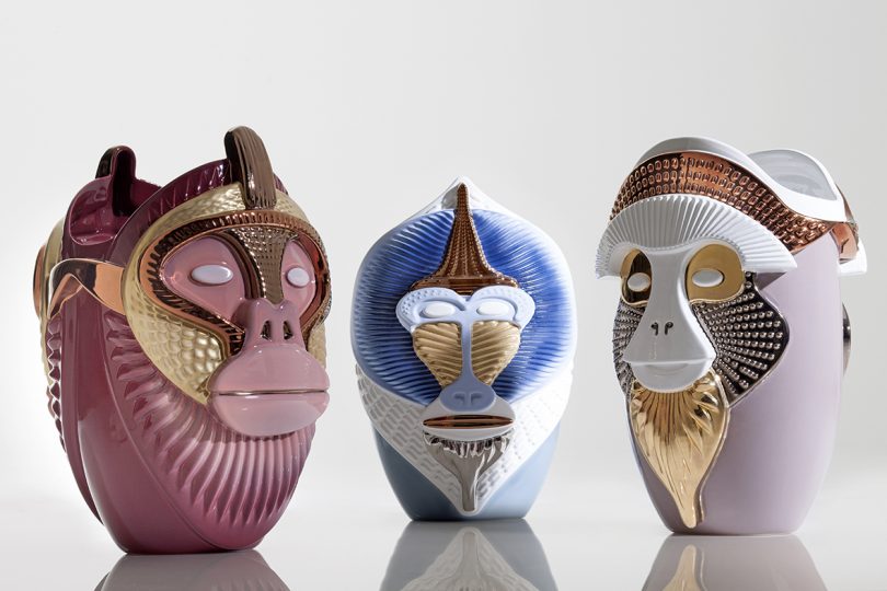 three ceramic vases sculpted to look like three monkey faces