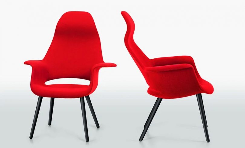 front and side profile views of a modern red armchair on white background