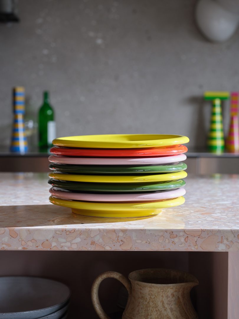 stack of multicolor plates on a kitchen counter