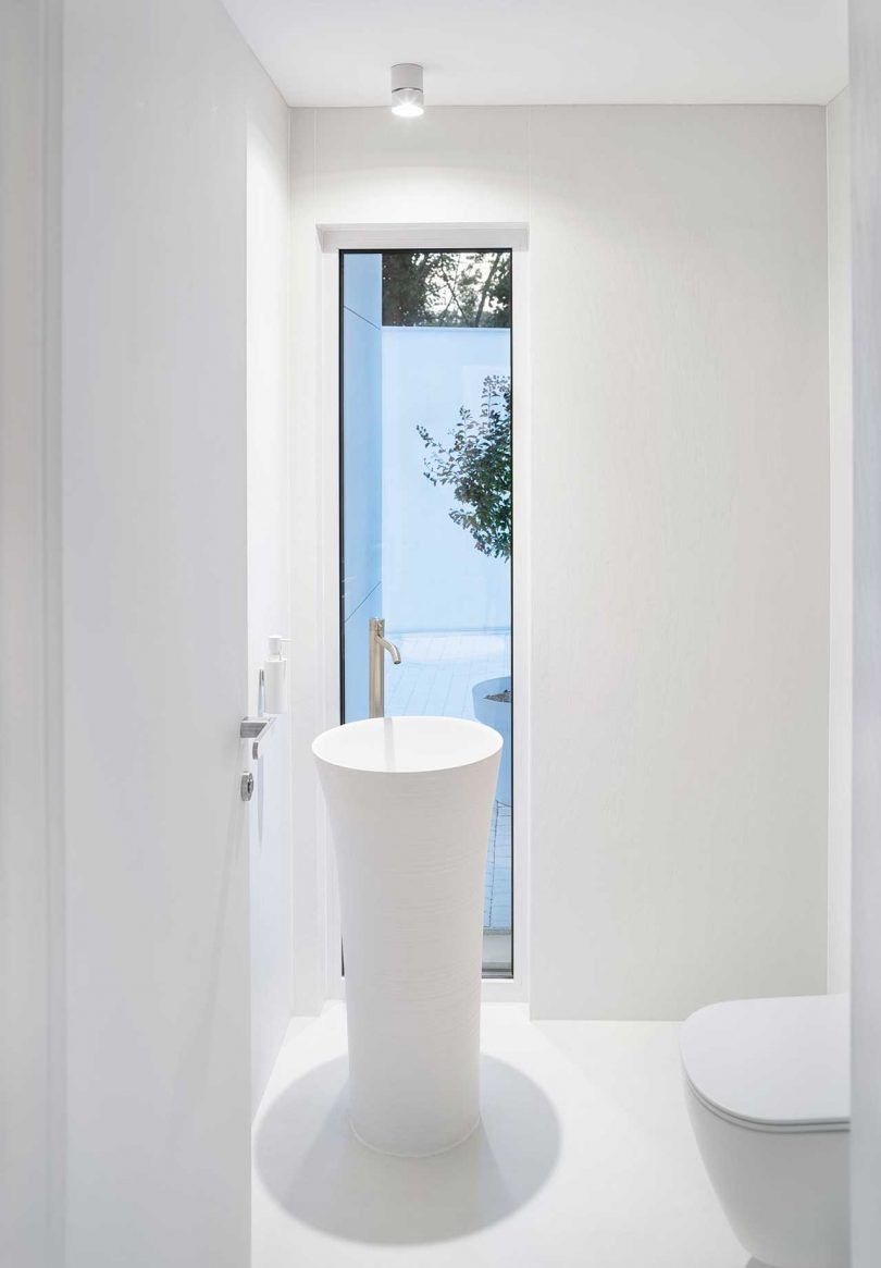 bathroom of minimalist all-white modern house