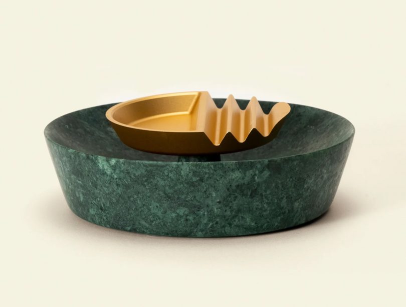 Green marble base with gold aluminum ashtray.