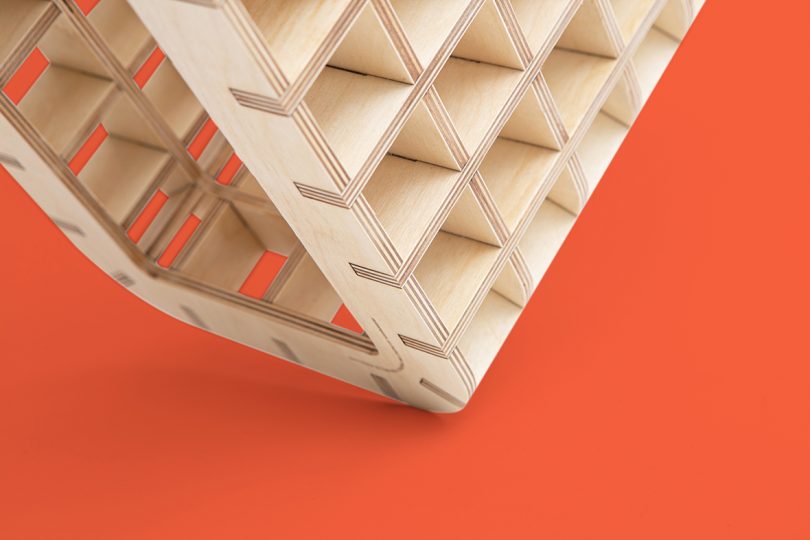 detail of wood box-like furniture on red background