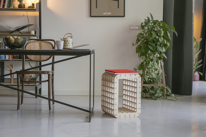 styled interior with a box-like stool and desk