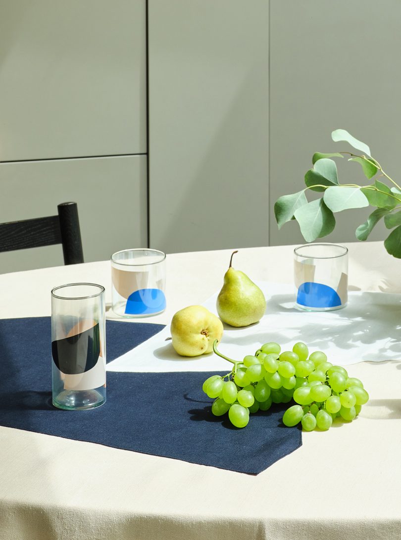 table styled with abstract patterned glassware and fruit